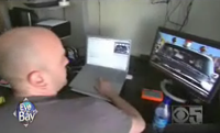 Man editing film on a computer.