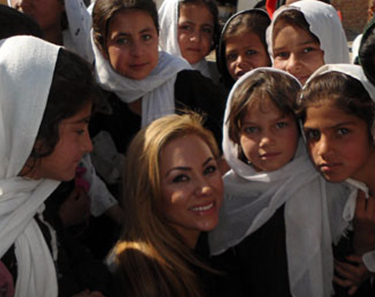CSUEB alumna Shakira Niazi '93 with girls in her native Afghanistan.