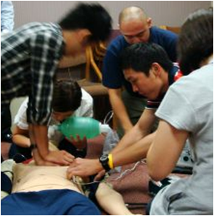 students working on a cardiac training dummy.